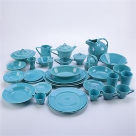 Vintage Homer Laughlin "Harlequin Turquoise" Ceramic Tableware: A selection of vintage Homer Laughlin Harlequin Turquoise ceramic tableware. This selection includes thirty-nine pieces of blue glazed tableware with an embossed ring design. These items are unmarked.