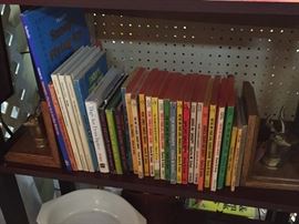 Lot's of Snoopy Books and a Set of Brass and Wood Deer Bookends.