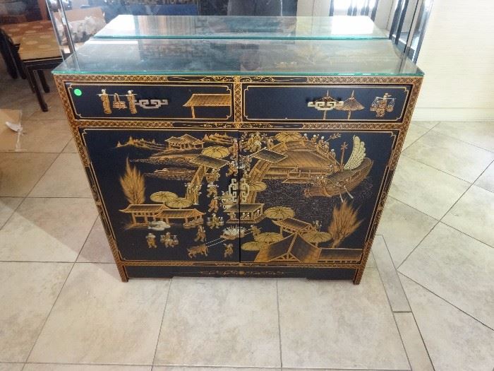 CHINESE BLACK ENAMEL CABINET, GOLD PAINTED LANDSCAPES, BRASS PULLS, 2 DRAWERS ABOVE 2 DOOR CABINET