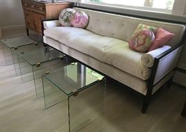 Elegant vintage sofa with three modernistic glass tables