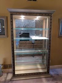 Beautiful Pulaski Curio cabinet with lighting and beveled glass.