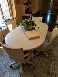 Solid Maple Kitchen table with four chairs on casters and leaf. Soooo comfortable!