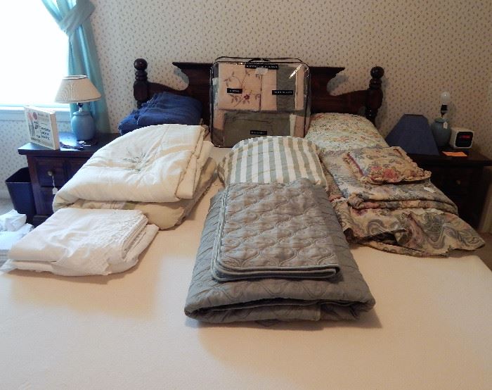 Assortment of comforters, linens, and towels (not all are shown)