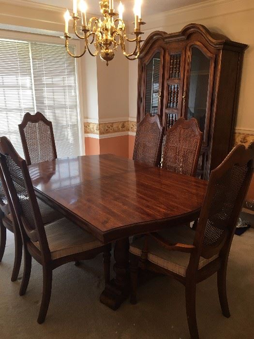 Dining set includes hutch, table with 6 chairs, two leaves and table pads for full table extension