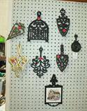 Many trivets - examples of a few iron ones.