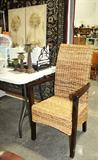 Lots of garden tools and decor. Home decor. Nice rattan style chair.