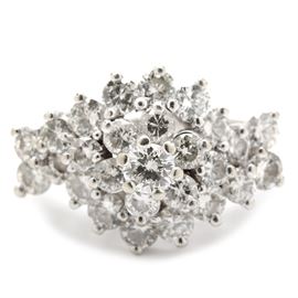 14K White Gold 1.97 CTW Diamond Ring: A 14K white gold ring set with a cluster of twenty-six prong set round brilliant cut diamonds.