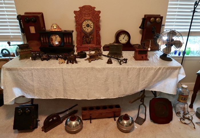 Antique Clocks, Fan, Telephones, Cast Iron Pieces, Coffee Grinders, Smudge Pots, Tobacco Cutter, Bottle Capper & Misc.