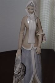 Maiden with her dog. This was made in the Lladro factory but has no markings