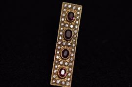 Rubies, diamonds, and gold pin