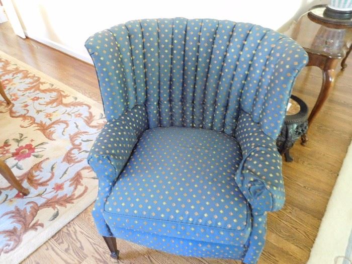 one  of  two  wingback  chairs