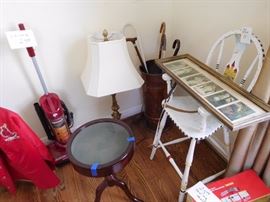 copper  umbrella  stand  ,display  table, white  chair