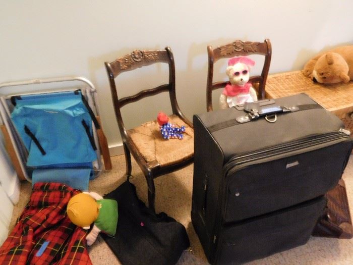 two vintage chairs  and  luggage