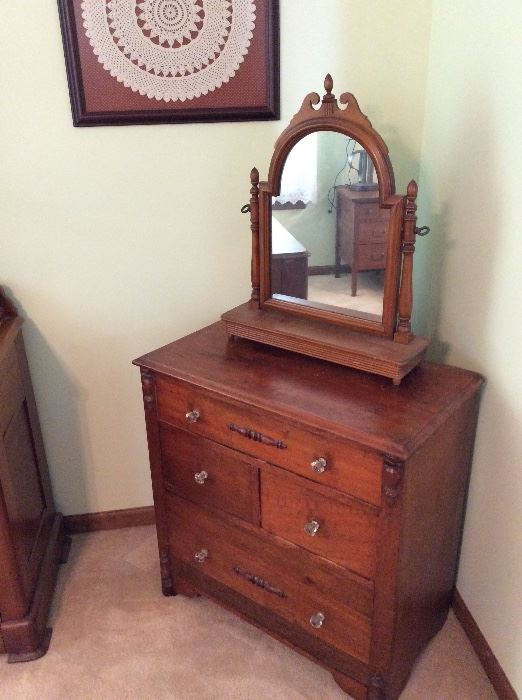 Small antique walnut chest of drawers and dresser stand swing mirror.
