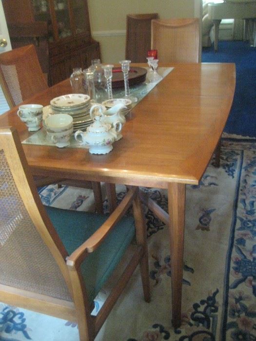 Chairs sold.  Table available with matching breakfront.  Early Heritage.