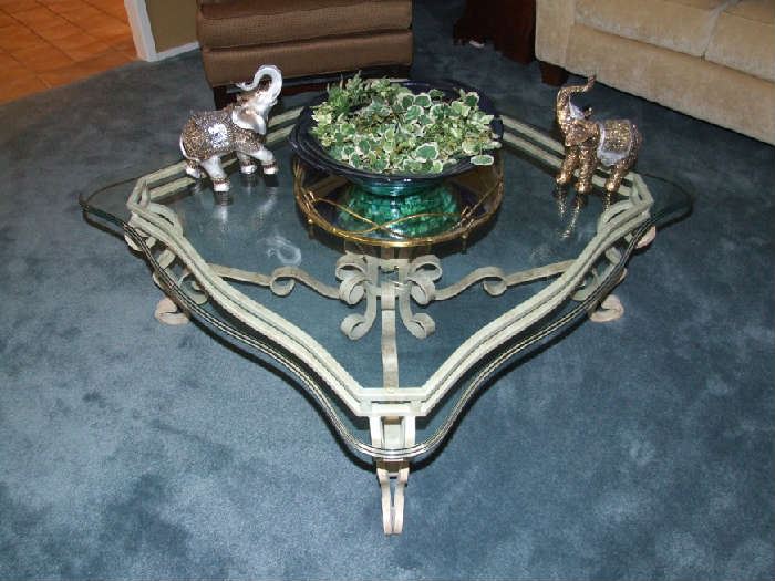 ELEGANT THICK BEVELED GLASS TOP COFFEE TABLE. THICK IRON BASE.  COMES APART FOR EASY TRANSPORT. EXCELLENT CONDITION TOO. 50% OFF