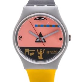 Vintage 1986 Swatch "Osiris Egypt" Plastic Wristwatch: A Swatch Osiris Egypt wristwatch, circa 1986, featuring a gray plastic case housing a multi-color dial containing Egyptian motifs with gray tone hands and a red seconds hand leading into a color blocked plastic adjustable strap in yellow and black.