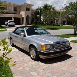 1993 Mercedes-Benz 300-Class Convertible Coupe: A circa silver-tone, two-door 1993 Mercedes-Benz 300-class Jupiter convertible coupe. The VIN is WDBEA66E5PB985871. Mileage at time of cataloging: 161167. Purchased from Stuttgart, Germany through Dowd Imports European Delivery Program, shipped to US Customs port in Baltimore. Single owner well-maintained vehicle.