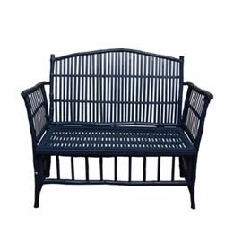 Blue Painted Bench: A painted blue bench. This bench features a rattan-like frame with a curved crest and straight, tall arms. It features a slatted back and seat with a long apron to the front. It is unmarked.