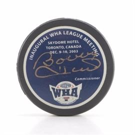 WHA Bobby Hull Signed Hockey Puck: A World Hockey Association Bobby Hull signed hockey puck. This commemorative hockey puck is marked on one side “Inaugural WHA League Meeting – Skydome Hotel – Toronto, Canada – Dec. 9-10, 2003”. To find out more about Bobby Hull (1939- ), an NHL Hall of Famer, please see the link in the additional information below.
