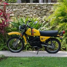 Kawasaki KM 100 Yellow Motorcycle: A Kawasaki KM 100 motorcycle. This Kawasaki KM 100 motorcycle, serial number KM100A-027346 with 464.9 miles features a five speed transmission with expanding front and rear brakes. The motorcycle has a 2.5 X 16 front tire and a 3 X 14 rear tire.