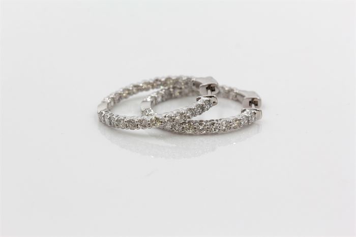 18K White Gold 2.05 CTW Diamond Inside Out Hoop Earrings: A pair of white gold diamond inside out hoop earrings. The earrings are in excellent condition and have never been worn.