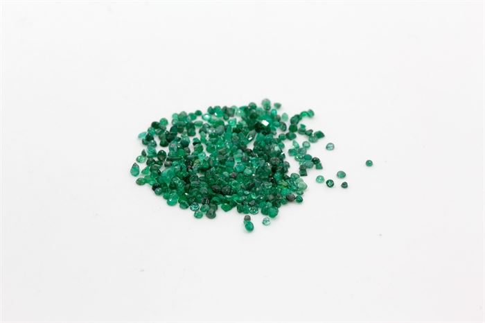 15.28 CTW of Emeralds: A collection of small loose faceted emeralds in a variety of cuts.