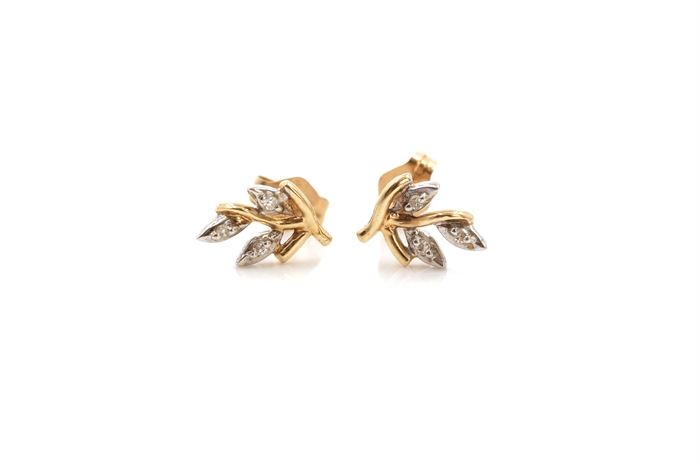 14K Yellow Gold Diamond Earrings: A pair of yellow gold earrings with branch like appearance accented by diamond “leaves”.