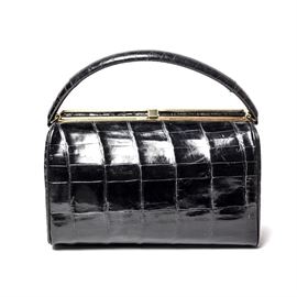 Bellestone Vintage Alligator Handbag: A vintage Bellestone alligator handbag in classic black with brass details and neutral leather interior. Maker’s mark to interior in gilt script.