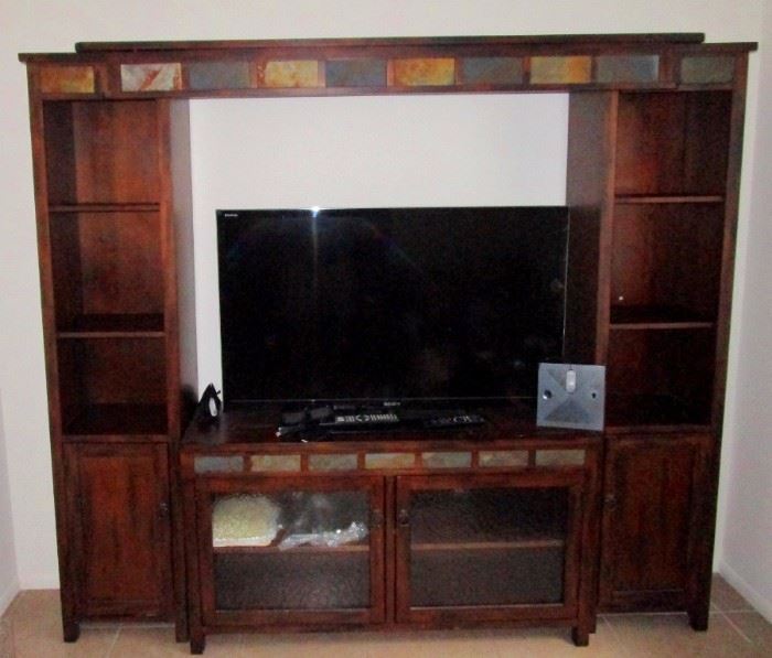 Handsome entertainment consol & Sony flat screen TV. This comes with a set of stereo glasses for really cool 3-D viewing plus a satellite dish receiving square that will enable one to dodge cable fees.