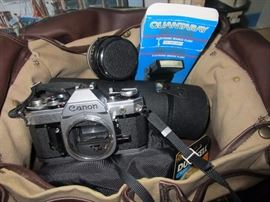 35 mm Canon reflex camera with all kinds of extra lenses including telephoto