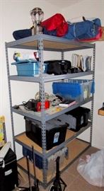 Camping gear, tents, sleeping bag, battery charger, electrical items. Shelving is for sale also.