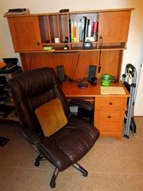 Office desk with comfy brown leather office chair