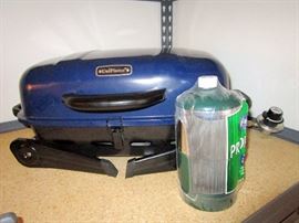 Portable propane stove with two extra gas tanks.