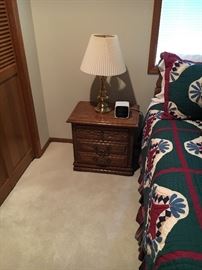Bedside table and one of two brass lamps