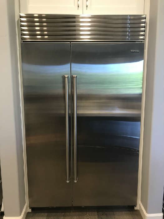 Pristine Stainless steel Sub Zero Side by Side Refrigerator/Freezer with ice maker 
 Width: 48"
 Height: 84"
 Counter Depth: 24"

 Fridge- 18.8 CU. ft
 Freezer- 9.5 CU. ft
 Total- 28.3 CU.ft 