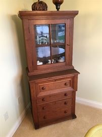 Antique small two piece cupboard, most likely cherry.