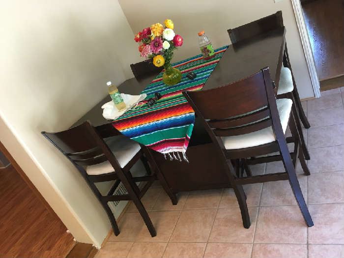 high top dining table with center storage cabinet and 4 chairs