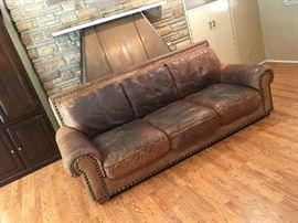 leather sofa, quite worn but still feels good for sitting. we covered it with a serape and it looked great.