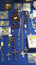 Many religious rosary's, pins necklaces etc
