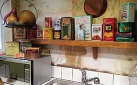 Kitchen - hanging scale, big fruit, advertising times and microwave