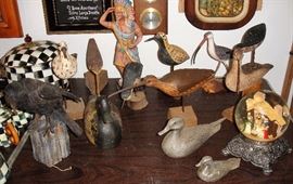 Shore birds, Indian figurine and snow-globe