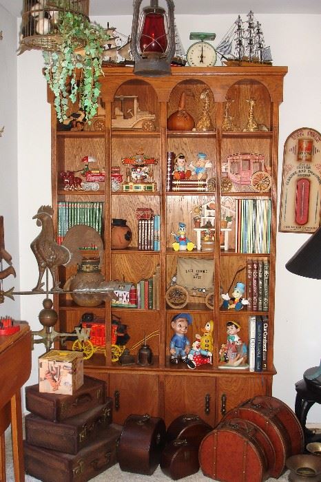 Hand built bookcase with books and collectibles, nested suitcases & Dietz lamp with red glass
