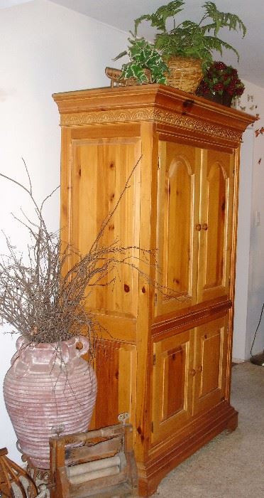 Pine TV armoire, laundry roller, terra cotta vase
