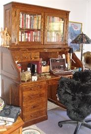 Roll top oak desk with book cabinet above