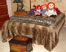 Comfort Aire adjustable bed together with boxes, dolls and faux fur spread and throws.