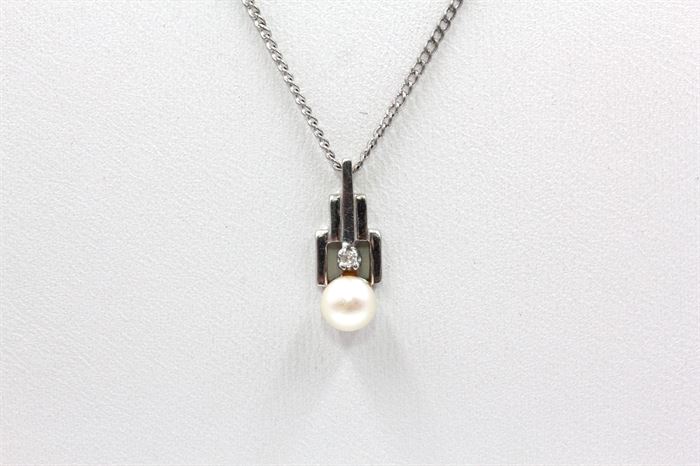 14K White Gold Plated Pearl and White Sapphire Pendant Necklace: A structured white gold plated pendant with round cut white pearl to the bottom and round cut white sapphire accent above on a thin silver tone curb chain.