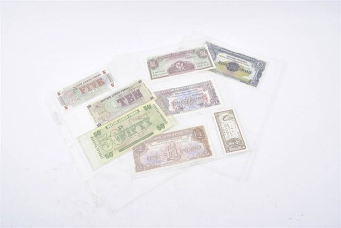 Collection of British Armed Forces Banknotes: A collection of British Armed Forces banknotes. This selection features 8 banknotes in total. Seven of the banknotes are issued by the British Armed Forces in denominations of 5 pence, 10 pence, 50 pence, three 1 one pound and 1 five pound bills. The smallest bill is 1 cent note from the government of Hong Kong.