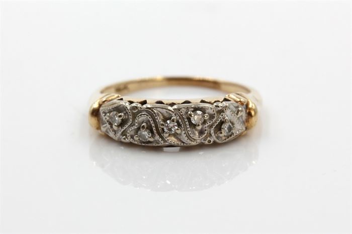 14K Yellow Gold Diamond Ring: A yellow gold shank with white gold diamond accented milgrain hearts to the top.