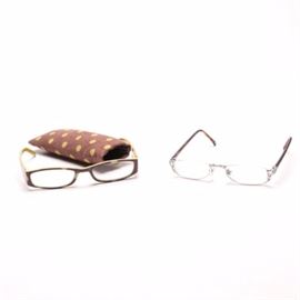 Prescription Eye Glasses Including Brighton "Shakespeare" and More: A collection of eye glasses. This collection of two pairs of glasses includes a pair of Brighton Shakespeare with faux torture shell temple pieces and silver tone hinges and bridge. Also included is a pair of yellow and brown polka-dot framed glasses with matching bag from peeperspecs.com.